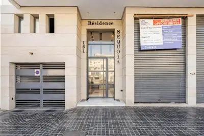 an entrance to a building with two garage doors at Studio Cosy, corniche à 2 min , Parking , Netflix in Casablanca
