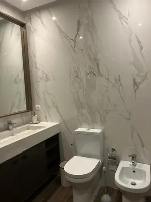 a bathroom with a white toilet and a sink at شقة فخمه Luxury apartment in Casablanca