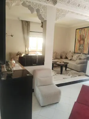 a living room with a chair and a couch at Sense house 2 in Rabat