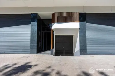 a building with a black door on the side of it at Acacia Studio 10 in Casablanca