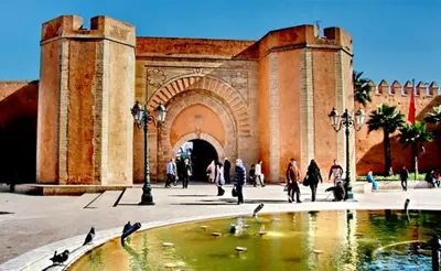 a group of people walking in front of a building at Maison 2pc plain-pied -centre in Rabat