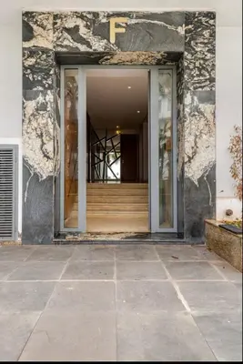 a door to a building with a staircase in it at Sunshine sea view studio in Casablanca