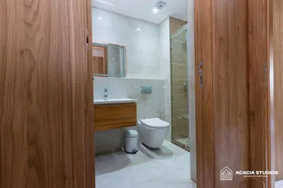 a bathroom with a toilet and a sink and a mirror at Acacia Studio 01 in Casablanca