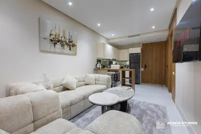 a living room with a couch and a table at Acacia Studio 03 in Casablanca