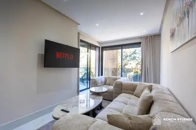 a living room with a couch and a table at Acacia Studio 04 in Casablanca