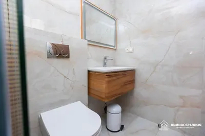 a bathroom with a white toilet and a sink at Acacia Studio 04 in Casablanca