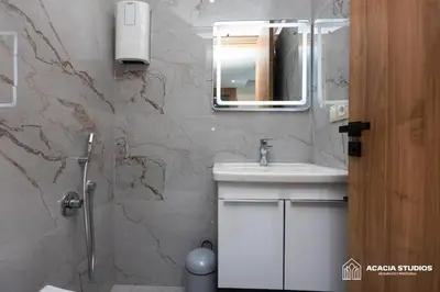 a bathroom with a sink and a mirror at Acacia Studio 04 in Casablanca