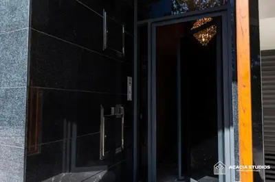 a door to a building with a chandelier on it at Acacia Studio 05 in Casablanca