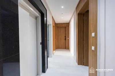 a hallway in a house with wooden doors at Acacia Studio 05 in Casablanca