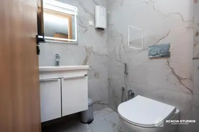 a bathroom with a white toilet and a sink at Acacia Studio 07 in Casablanca