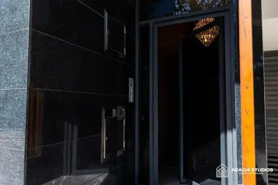 a door to a building with a chandelier on it at Acacia Studio 07 in Casablanca