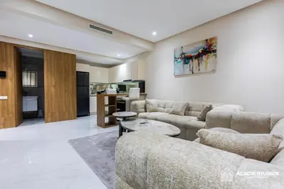 a living room with two couches and a table at Acacia Studio 11 in Casablanca