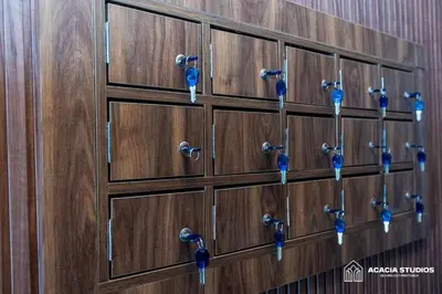 a row of wooden lockers with blue handles at Acacia Studio 12 in Casablanca