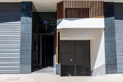 a building with a black door on the side of it at Acacia Studio 12 in Casablanca