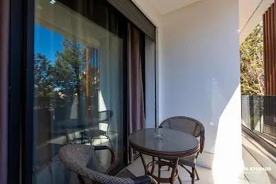 a balcony with a table and chairs and a window at Acacia Studio 13 in Casablanca