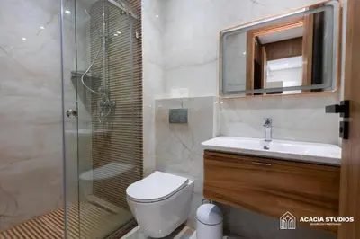 a bathroom with a shower and a toilet and a sink at Acacia Studio 14 in Casablanca