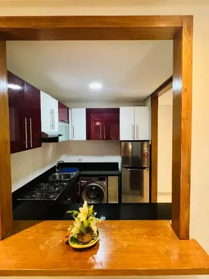 a kitchen with a table with a bowl of flowers on it at Ataraxia in Casablanca
