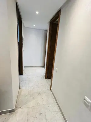 an empty hallway with a door and a tile floor at Ataraxia in Casablanca