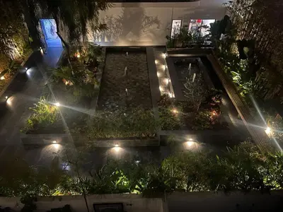 an overhead view of a garden at night with lights at L'oasis - by Mi-haven in Casablanca