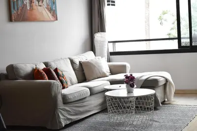 a living room with a couch and a table at Le Sacré-Coeur - by Mi-Haven in Casablanca