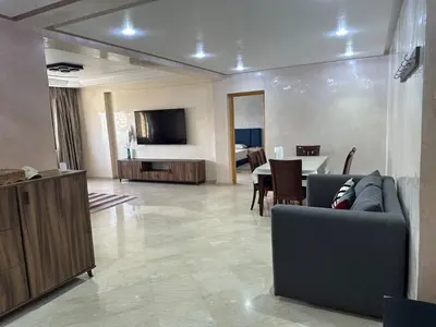 a living room with a couch and a table at apartment au coeur de Casablanca in Casablanca