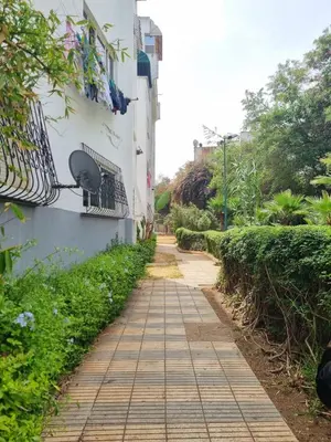 a walkway next to a white building with a window at Bayt El Fath in Casablanca