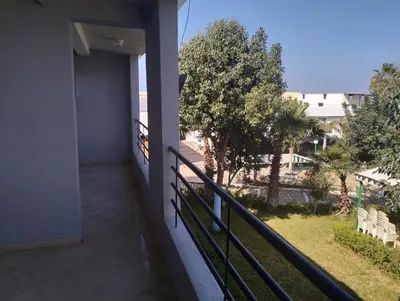 a balcony of a building with a view of a street at RiadNA in Bouznika