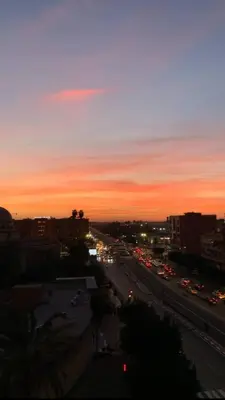 a view of a city with traffic at sunset at Blue Wave Apartment in Temara