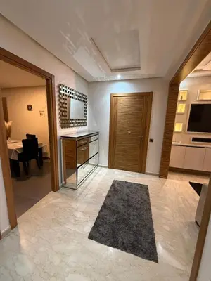 a living room with a desk and a dining room at Corniche in Casablanca