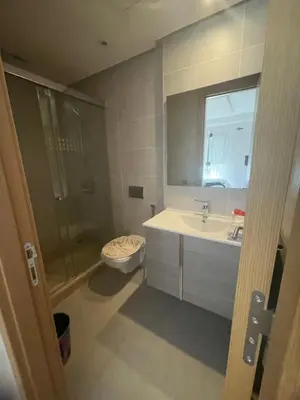a bathroom with a shower and a toilet and a sink at Studio moderne et élégant Idéal pour un séjour confortable in Rabat