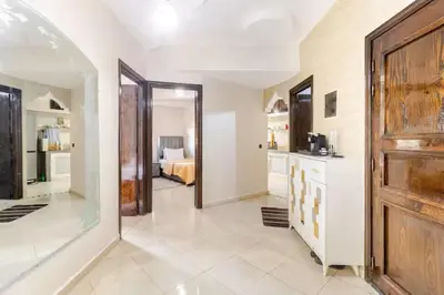 a hallway with a kitchen and a living room at Modern hideaway in Casablanca in Casablanca