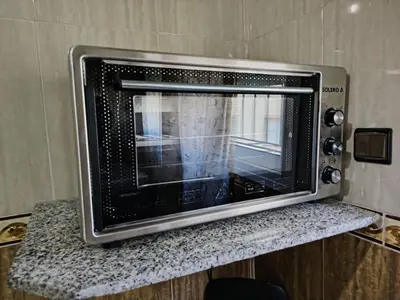 a microwave oven sitting on top of a counter at Modern hideaway in Casablanca in Casablanca