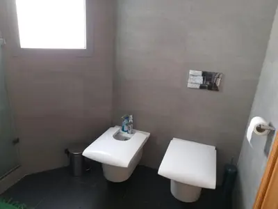 a bathroom with a white toilet and a sink at Stunning one bedroom flat at Casablanca Marina 10th floor Sea View in Casablanca