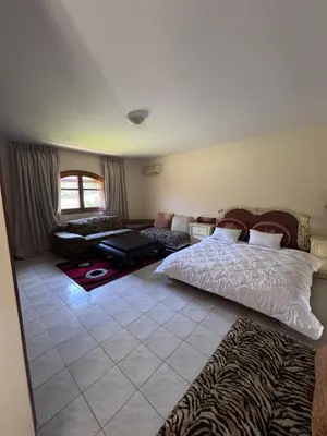 a bedroom with a bed and a living room at Villa élégante à Rabat,harhoura à 4 chambres in Rabat