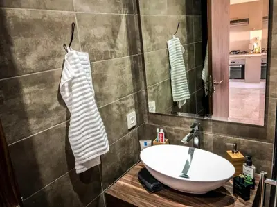 a bathroom with a sink and a mirror at Tranquil in Casablanca
