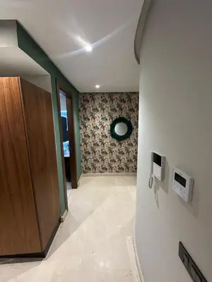 a hallway with a door and a wall at Signature Leving 119 in Casablanca