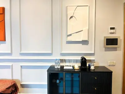 a room with a black cabinet and a wall at Luxury apartment Marina in Casablanca