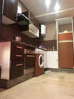 a kitchen with a washing machine and a washer at Bea & dozo in Casablanca