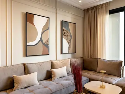 a living room with a couch and a table at Cozy & Modern Apartment with Rooftop Gym Great Casablanca Location in Casablanca