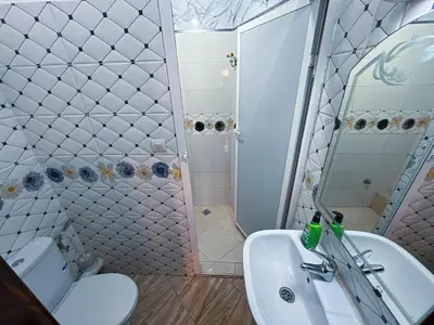 a bathroom with a sink and a toilet and a shower at Center Cozy Home in Casablanca