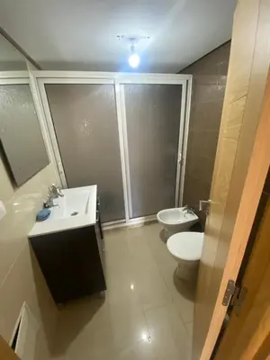 a bathroom with a sink and a toilet at Ola Blanca 2 in Tamaris