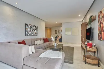 a living room with a couch and a table at Luxury 3 Bedroom Getaway in Bouskouras Finest in Bouskoura