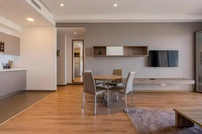 a kitchen and dining room with a table and chairs at Luxury Apartment, Seaview Close Beach in Casablanca