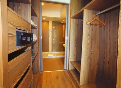a bathroom with wooden walls and a walk in closet at Luxury Apartment, Seaview Close Beach in Casablanca