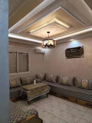 a living room with a couch and a table at Alia Apartment 25 in Casablanca