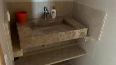 a bathroom with a sink with a faucet at Ferme a Ain Tizgha Benslimane in O Ben Slimane