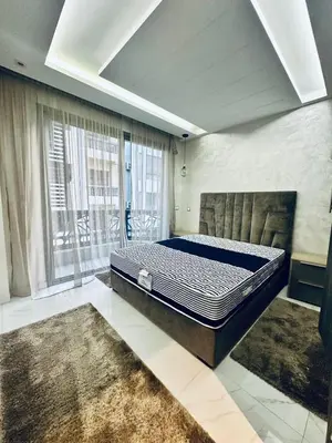 a bedroom with a bed in a room at Résidence Sheren in Casablanca