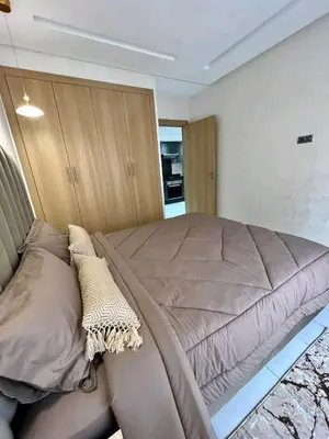a bedroom with a large bed in a room at Résidence sheren in Casablanca