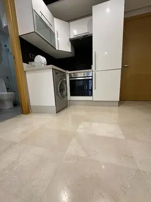a kitchen with a washer and dryer in it at Res in Casablanca
