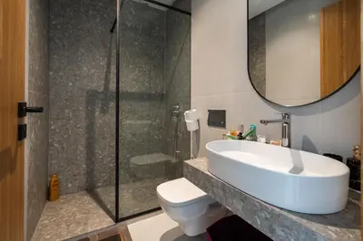 a bathroom with a sink and a shower at Luxurious studio with view gym parking and keyless access in Casablanca
